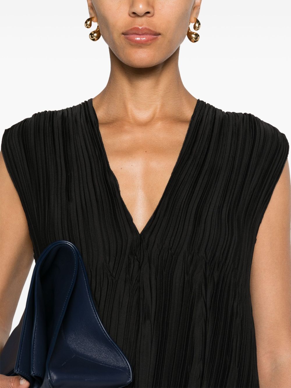 sleeveless pleated blouse